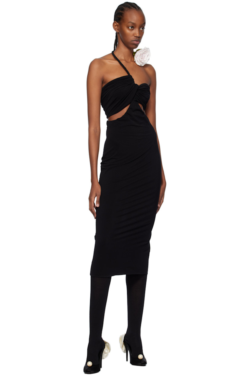 Stretch nylon crepe dress. Gathering and draping throughout. 

· Covered wire trim at modified sweetheart neck
· Floral appliqué at wire
· Twisted detailing at chest 
· Cut-outs at chest and side seams
· Zip closure at back 
· Vented back hem 

Supplier color: Black