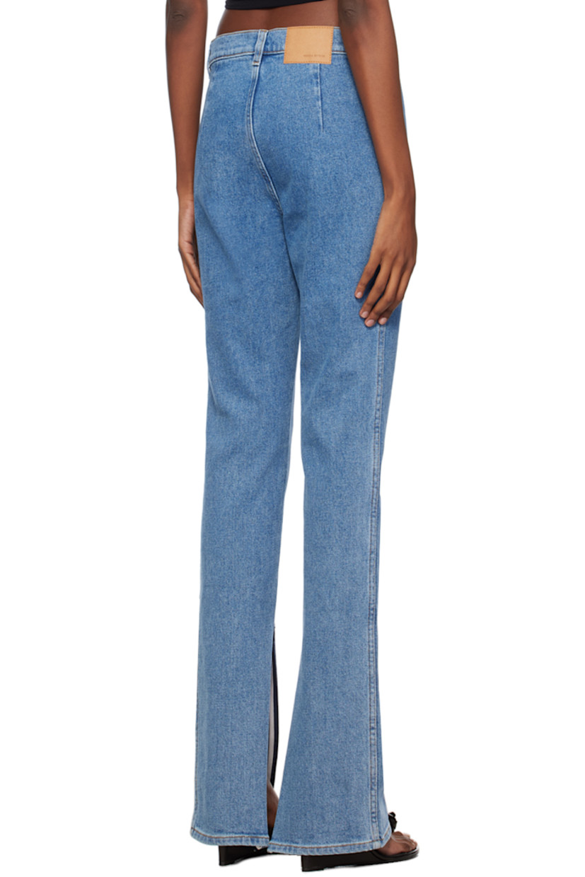 Stretch denim jeans. Fading throughout.

· High-rise
· Belt loops
· Zip-fly
· Zip vent at cuffs
· Logo patch at back waistband

Supplier color: Blue
