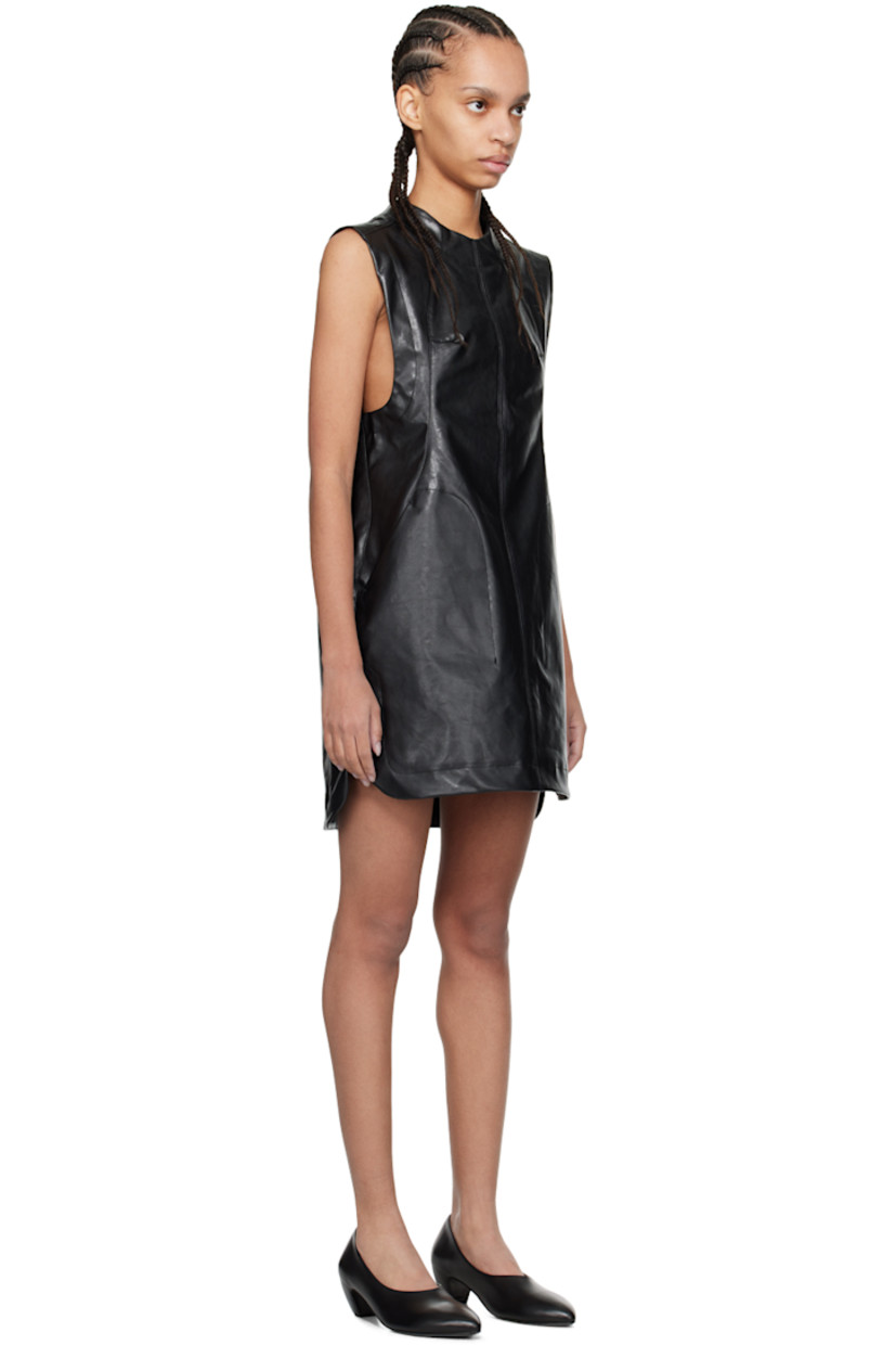 Coated grained faux-leather dress.

· Paneled construction
· Crewneck
· Darts at chest
· Welt pockets
· Vented side seams
· Button fastening at back collar
· Full bonded gabardine lining

Supplier color: Black