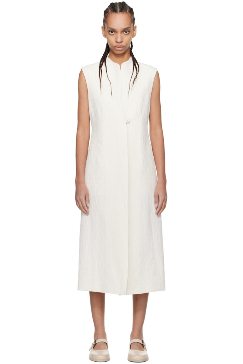 Garment-dyed cotton- and viscose rayon-blend matelassé jacket. Jacquard graphic pattern throughout. 

· Wrap construction 
· V-neck
· Handcrafted single-button closure 
· Inverted box pleat at hem 
· Seam pockets 
· Central vent at back hem

Supplier color: White