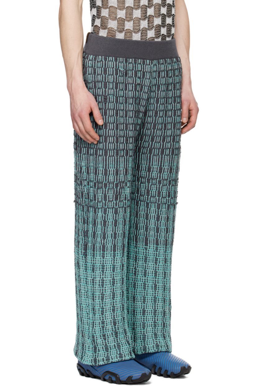Knit cotton trousers. Jacquard gradient check pattern throughout.

· Elasticized waistband
· Two-pocket styling
· Logo flag at back waistband

Available exclusively at SSENSE.

Supplier color: Haze