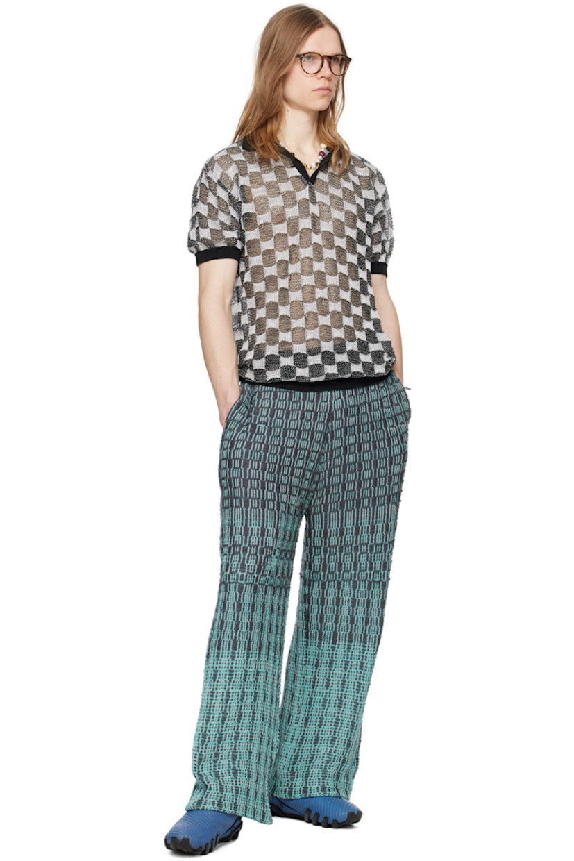Knit cotton trousers. Jacquard gradient check pattern throughout.

· Elasticized waistband
· Two-pocket styling
· Logo flag at back waistband

Available exclusively at SSENSE.

Supplier color: Haze