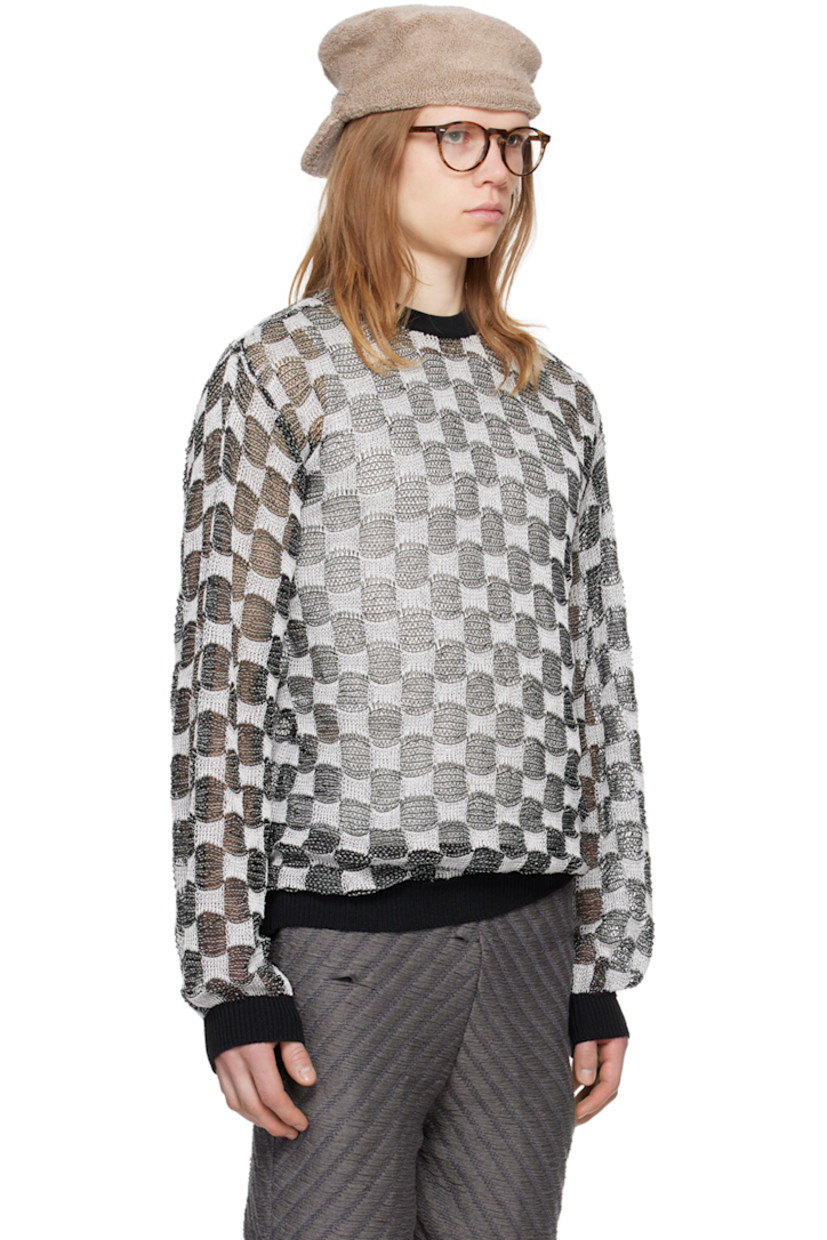 Open knit rayon sweater. Jacquard check pattern throughout.

· Rib knit crewneck, hem, and cuffs
· Dropped shoulders
· Logo flag at back hem

Available exclusively at SSENSE.

Supplier color: BNW