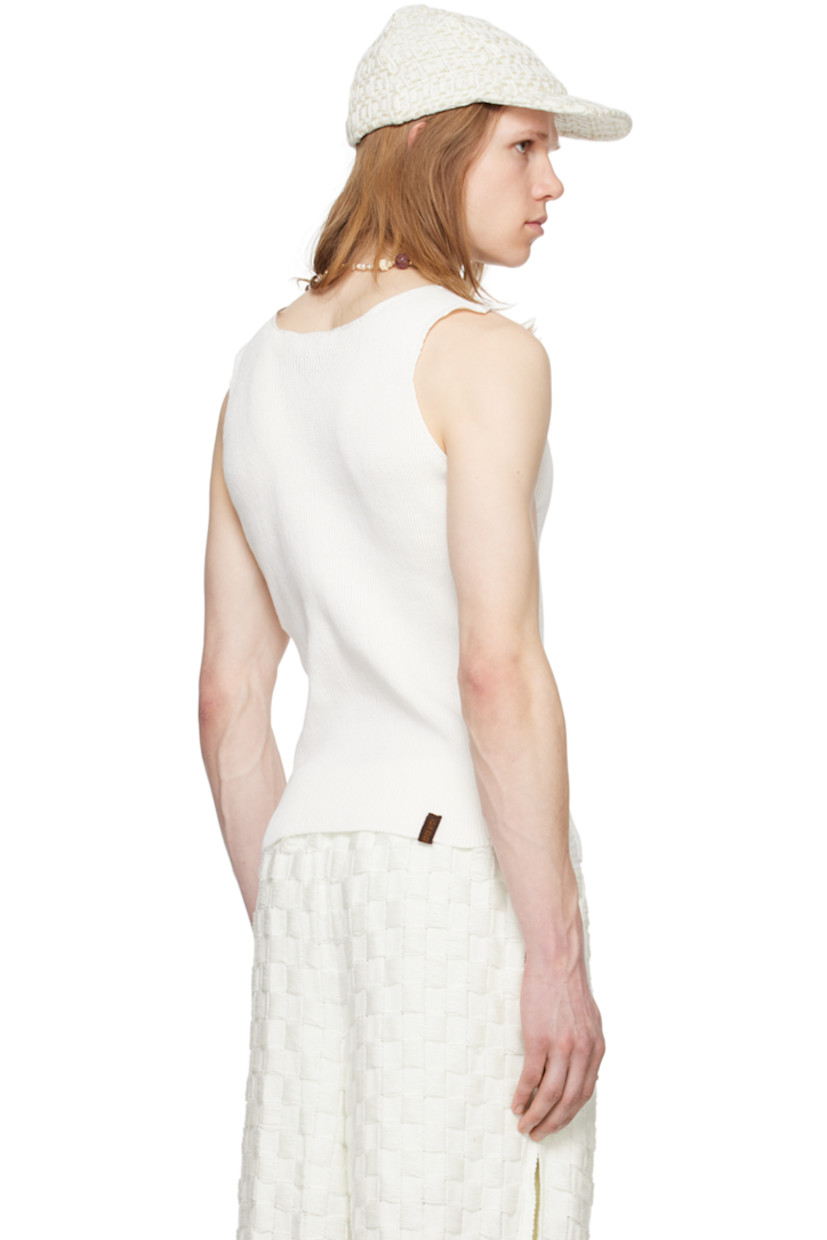 Rib knit cotton tank top.

· Scoop neck
· Laddering at side seams
· Logo flag at back hem

Available exclusively at SSENSE.
 
Supplier color: White