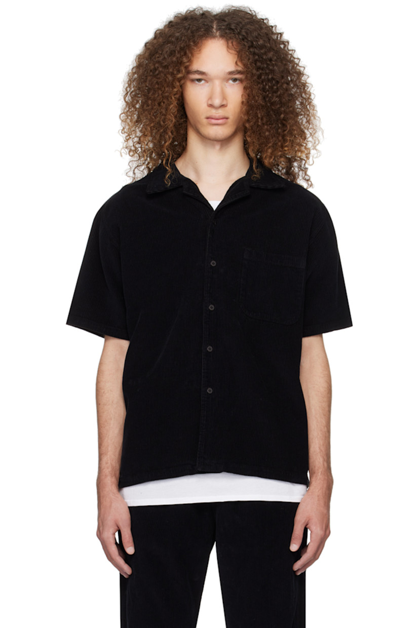 Garment-dyed heavyweight cotton corduroy shirt. 

· Pre-shrunk
· Open spread collar
· Button closure 
· Patch pocket
· Shirttail hem

Supplier color: Black