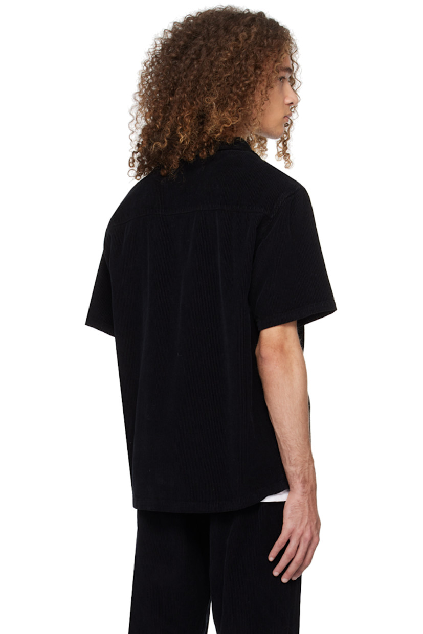 Garment-dyed heavyweight cotton corduroy shirt. 

· Pre-shrunk
· Open spread collar
· Button closure 
· Patch pocket
· Shirttail hem

Supplier color: Black