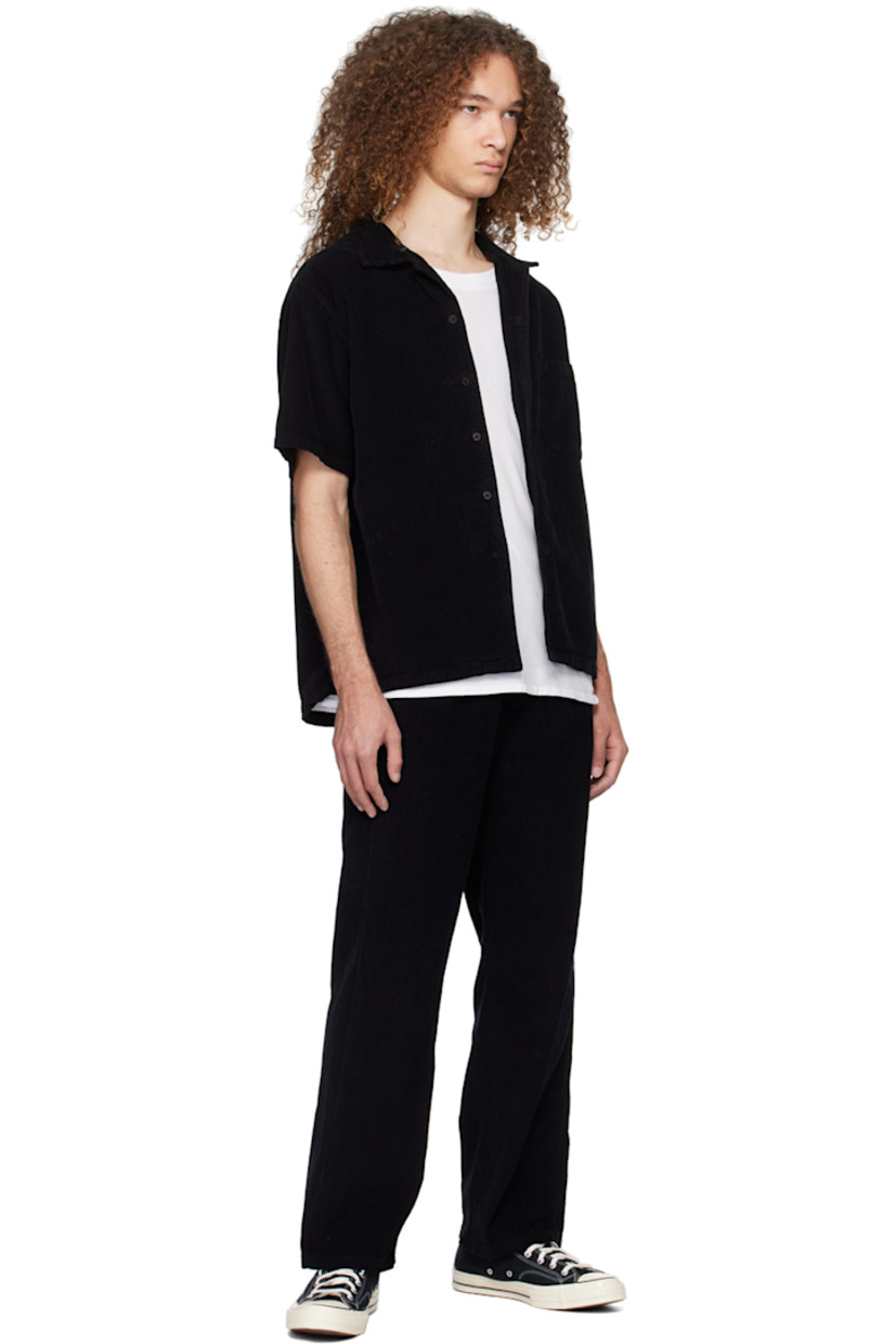 Garment-dyed heavyweight cotton corduroy shirt. 

· Pre-shrunk
· Open spread collar
· Button closure 
· Patch pocket
· Shirttail hem

Supplier color: Black