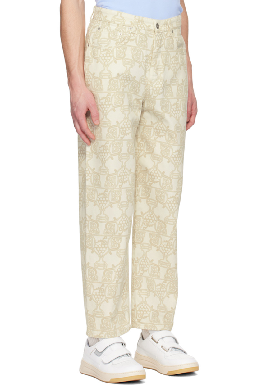Relaxed-fit non-stretch denim jeans. Graphic pattern printed throughout.

· Belt loops
· Five-pocket styling
· Button-fly
· Leather logo patch at back waistband
· Logo-engraved silver-tone hardware

Supplier color: Ecru