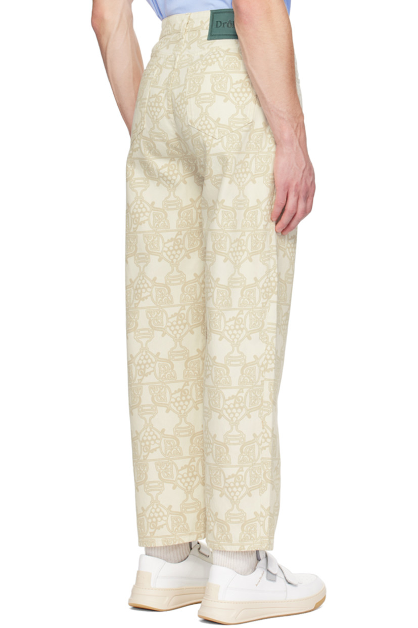 Relaxed-fit non-stretch denim jeans. Graphic pattern printed throughout.

· Belt loops
· Five-pocket styling
· Button-fly
· Leather logo patch at back waistband
· Logo-engraved silver-tone hardware

Supplier color: Ecru