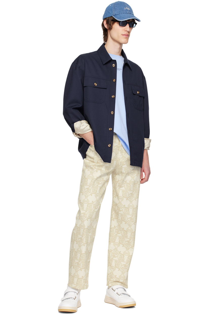 Relaxed-fit non-stretch denim jeans. Graphic pattern printed throughout.

· Belt loops
· Five-pocket styling
· Button-fly
· Leather logo patch at back waistband
· Logo-engraved silver-tone hardware

Supplier color: Ecru