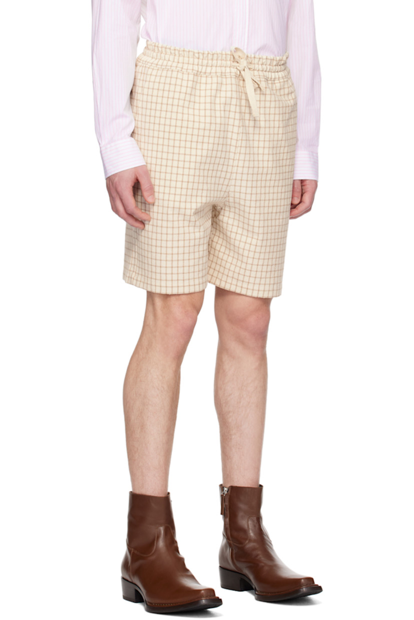 Slub cotton- and silk- blend canvas shorts. Check pattern throughout.

· Drawstring at elasticized waistband
· Three-pocket styling
· Logo patch at back patch pocket

Supplier color: Beige