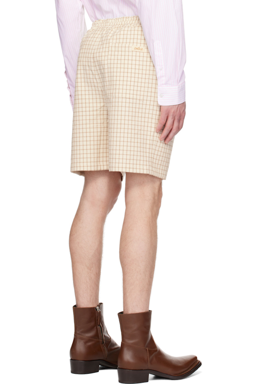 Slub cotton- and silk- blend canvas shorts. Check pattern throughout.

· Drawstring at elasticized waistband
· Three-pocket styling
· Logo patch at back patch pocket

Supplier color: Beige
