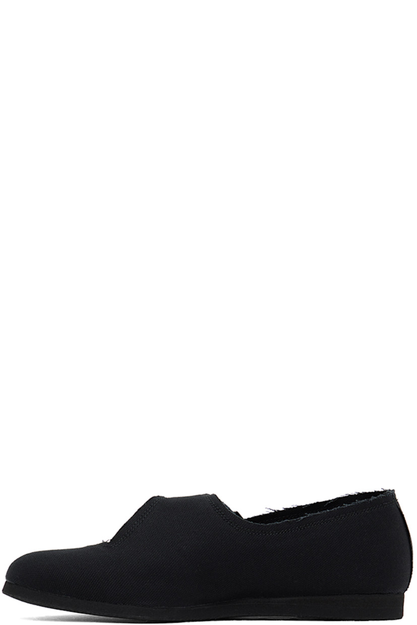 Lightweight cotton canvas Mary Jane-style ballerina flats in black.

· Raw edges throughout
· Adjustable leather strap at vamp
· Canvas lining
· Foam rubber midsole
· Treaded rubber sole

Supplier color: Black