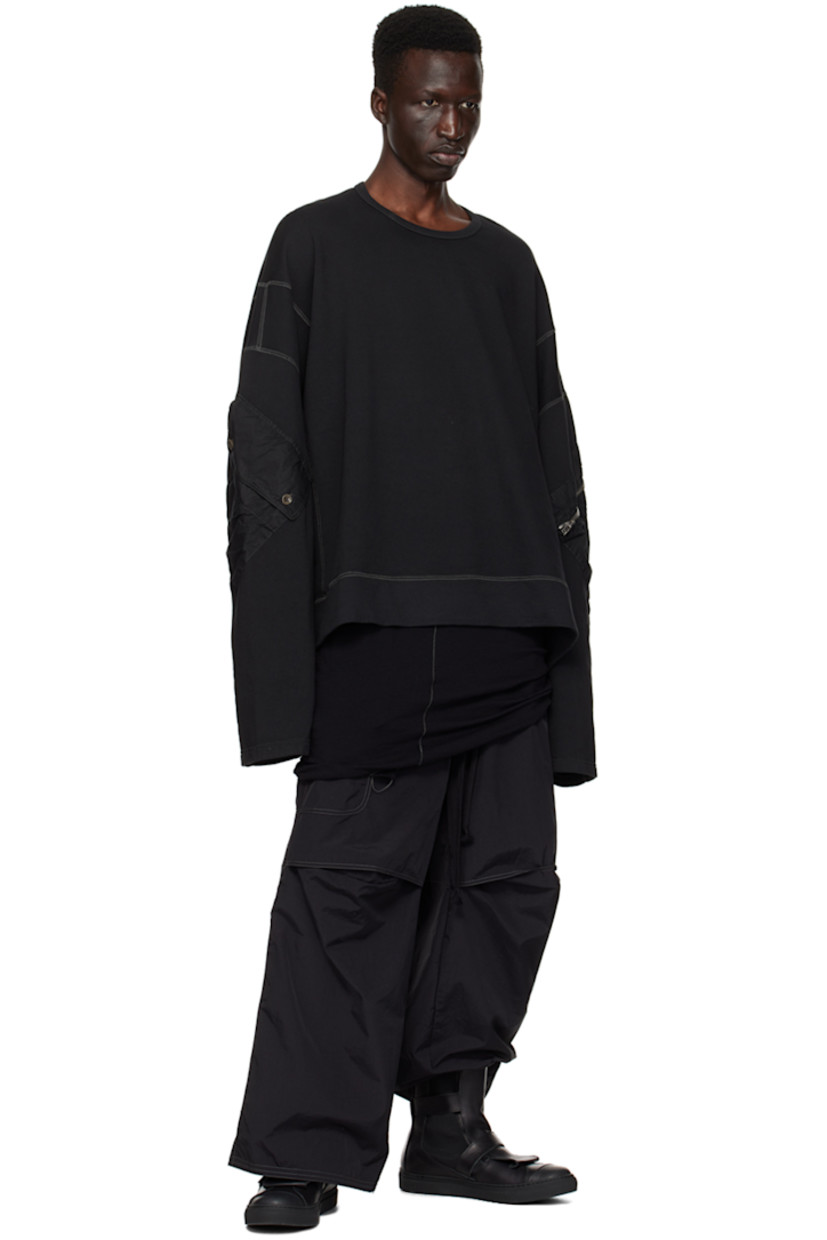 Handcrafted stretch nylon faille trousers. Loose thread detailing throughout. 

· Drawstring at elasticized waistband
· Four-pocket styling
· Zip-fly
· Darts and tucks at knees
· Partial cotton twill lining
· Contrast stitching in gray

Supplier color: Black