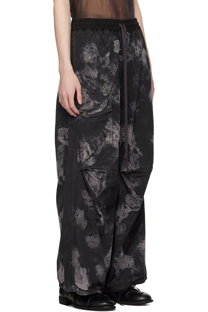 Handcrafted stretch nylon twill trousers. Graphic pattern printed and loose-thread detailing throughout.

· Paneled construction
· Drawstring at elasticized plain-woven cotton waistband
· Six-pocket styling
· Zip-fly
· Pleat at knees
· Flap pocket at outseam

Supplier color: Dark camo