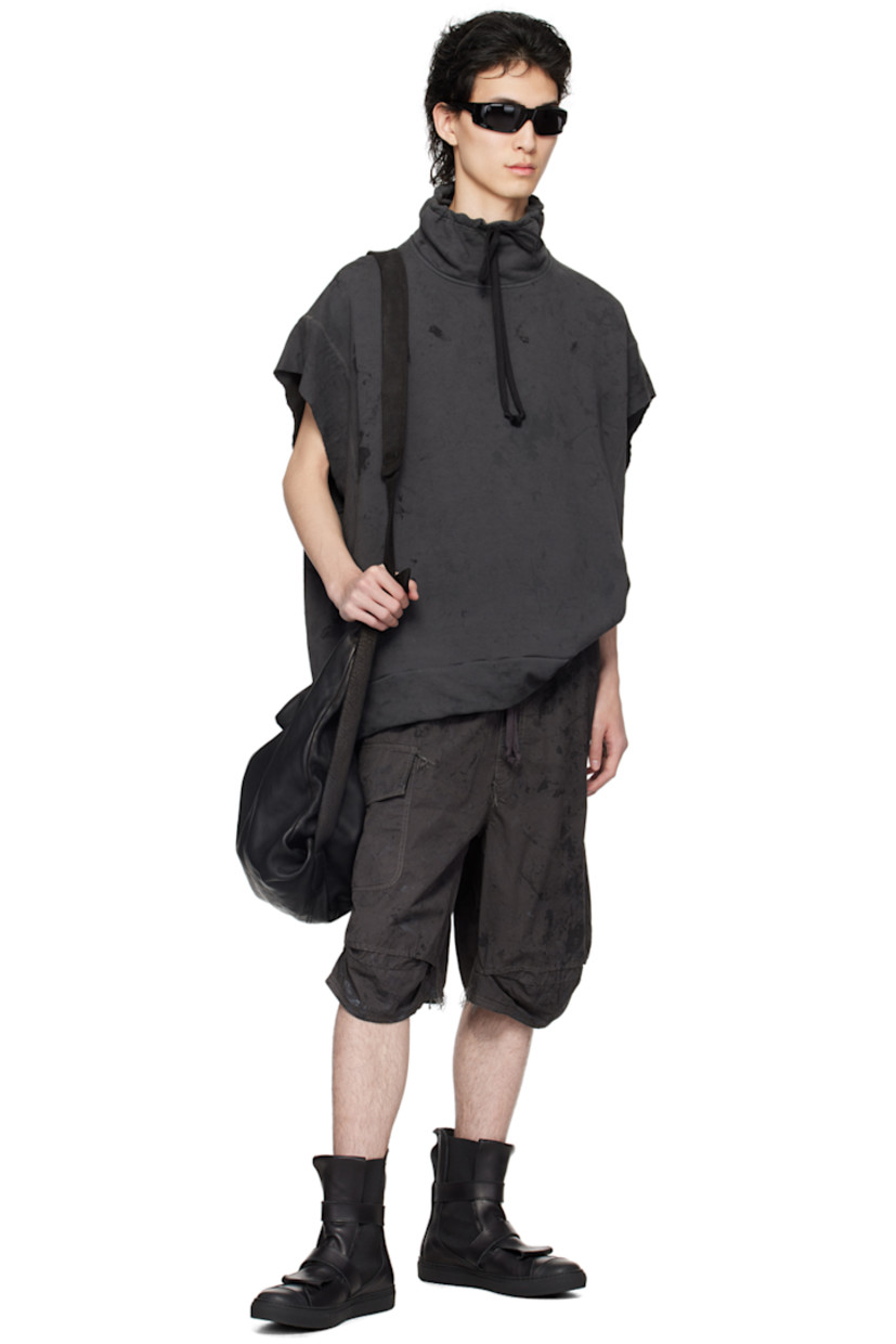 Handcrafted French terry sweatshirt. Graphic pattern printed and loose-thread detailing throughout.

· Paneled construction
· Drawstring at funnel neck
· Welt pockets
· Rib knit hem
· Raw edge at cap sleeves
· Dropped armscyes
· Contrast overlock stitching in gray

Available exclusively at SSENSE.

Supplier color: Urban camo