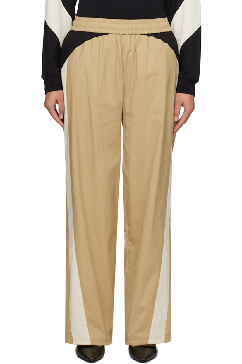 Cotton seersucker lounge pants. Topstitching throughout.

· Paneled construction
· Concealed drawstring at elasticized waistband
· Four-pocket styling
· Cord-lock drawstring at back legs and cuffs

Supplier color: Beige