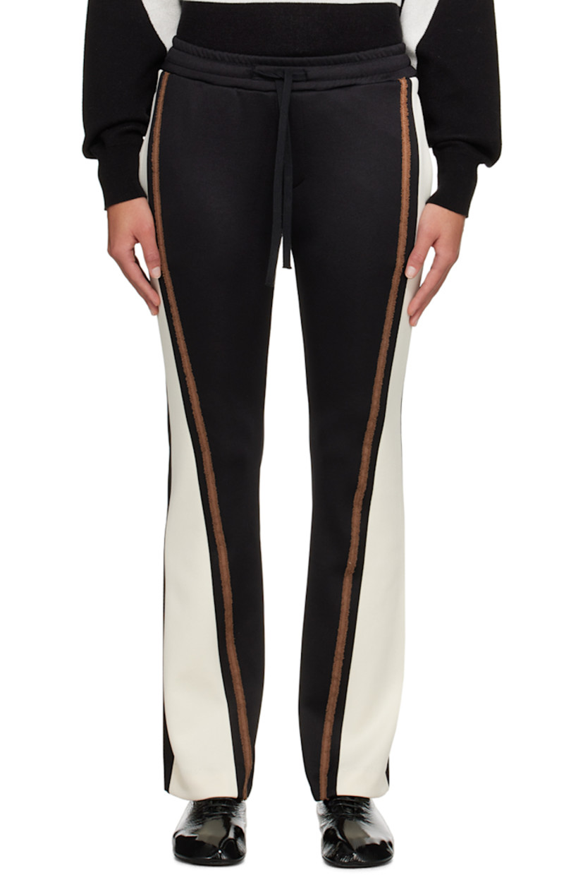 Flared stretch polyester-blend jersey track pants.

· Paneled construction
· Drawstring at elasticized waistband
· Four-pocket styling
· Frayed trim at outseams
· Logo embroidered at back pocket

Supplier color: Black/Cream