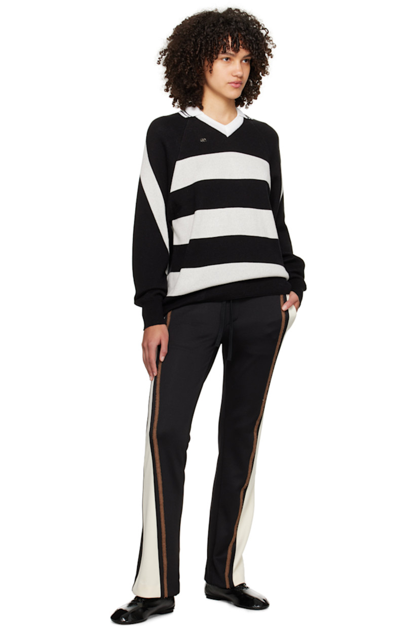 Flared stretch polyester-blend jersey track pants.

· Paneled construction
· Drawstring at elasticized waistband
· Four-pocket styling
· Frayed trim at outseams
· Logo embroidered at back pocket

Supplier color: Black/Cream