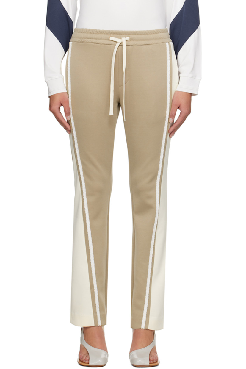 Flared stretch polyester-blend jersey track pants.

· Paneled construction
· Drawstring at elasticized waistband
· Four-pocket styling
· Frayed trim at outseams
· Logo embroidered at back pocket

Supplier color: Beige/Cream