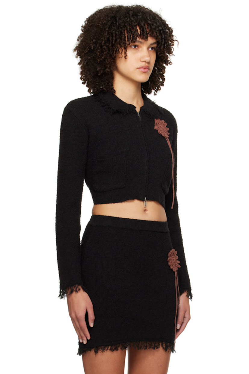 Brushed rib knit cotton-blend sweater. Frayed edges throughout.

· Spread collar
· Two-way zip closure
· Crocheted graphic appliqué at chest
· Patch pockets

Supplier color: Black