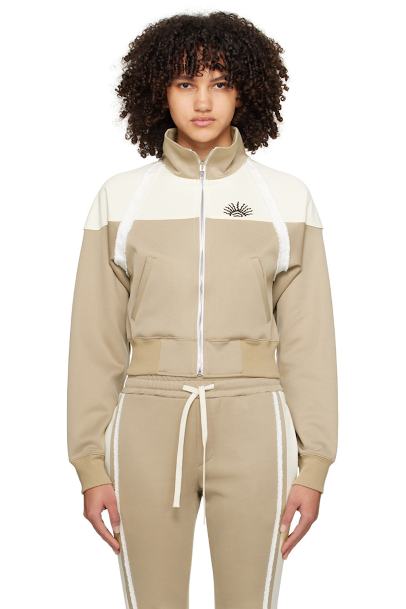 Stretch polyester-blend jersey track jacket. Frayed trim throughout.

· Paneled construction
· Stand collar
· Zip closure
· Graphic embroidered at chest
· Welt pockets
· Rib knit hem and cuffs
· Logo embroidered at back collar and back hem

Supplier color: Beige/Cream