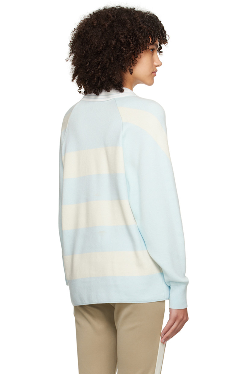 Knit cotton polo. Jacquard stripes throughout.

· Spread collar at rib knit V-neck
· Logo hardware at chest
· Raglan sleeves
· Rib knit cuffs

Supplier color: Sky blue/Cream