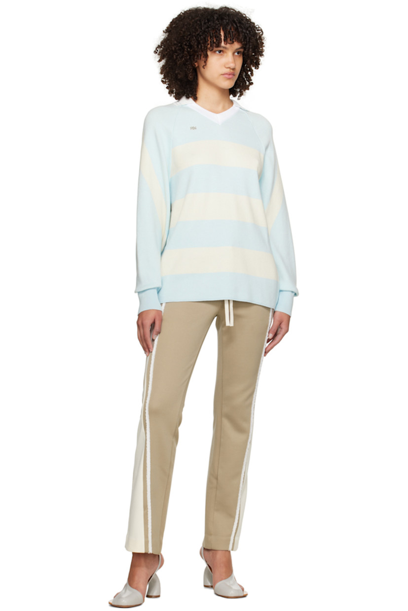 Knit cotton polo. Jacquard stripes throughout.

· Spread collar at rib knit V-neck
· Logo hardware at chest
· Raglan sleeves
· Rib knit cuffs

Supplier color: Sky blue/Cream