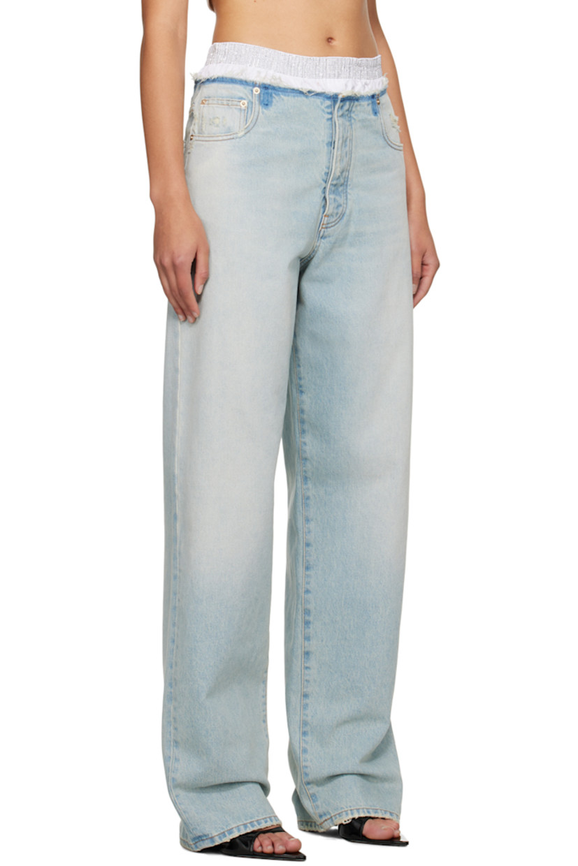 Loose-fit straight-leg non-stretch denim jeans. Fading, whiskering, and distressing throughout.

· Studs at elasticized waistband
· Five-pocket styling
· Button-fly
· Logo patch at back waistband
· Partial poplin lining
· Contrast stitching in orange

Supplier color: Blueish white