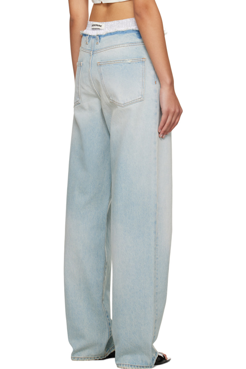 Loose-fit straight-leg non-stretch denim jeans. Fading, whiskering, and distressing throughout.

· Studs at elasticized waistband
· Five-pocket styling
· Button-fly
· Logo patch at back waistband
· Partial poplin lining
· Contrast stitching in orange

Supplier color: Blueish white