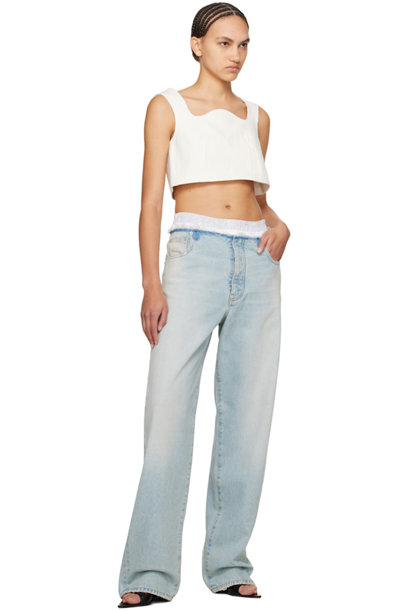 Loose-fit straight-leg non-stretch denim jeans. Fading, whiskering, and distressing throughout.

· Studs at elasticized waistband
· Five-pocket styling
· Button-fly
· Logo patch at back waistband
· Partial poplin lining
· Contrast stitching in orange

Supplier color: Blueish white