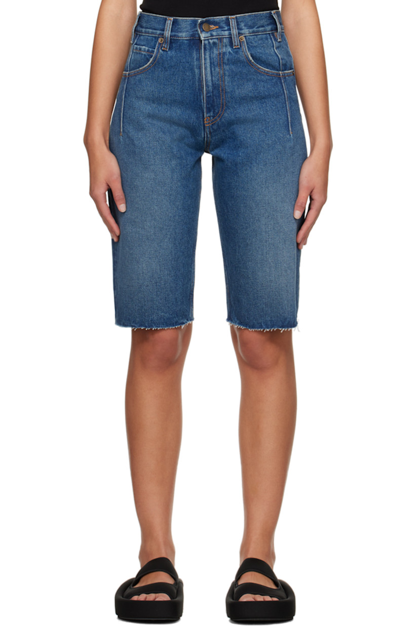 Non-stretch denim shorts. Darts, fading, and subtle distressing throughout.

· Belt loops
· Five-pocket styling
· Zip-fly
· Raw edge at cuffs
· Logo patch at back waistband
· Contrast stitching in tan

Supplier color: Medium wash