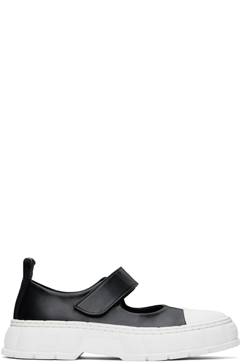 Handcrafted low-top PETA-certified buffed AppleSkin™️ faux-leather Mary Jane-style sneakers in black.

· Rubber cap toe
· Velcro strap at vamp
· Canvas trim and pull-loop at heel tab
· Logo embossed at heel counter
· Logo printed at padded footbed 
· Grained faux-leather lining
· Textured rubber platform midsole
· Treaded recycled rubber sole

Supplier color: Black apple