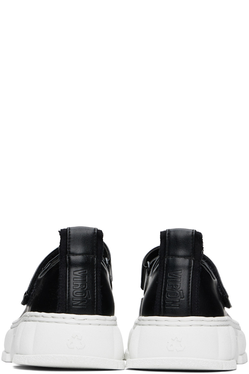 Handcrafted low-top PETA-certified buffed AppleSkin™️ faux-leather Mary Jane-style sneakers in black.

· Rubber cap toe
· Velcro strap at vamp
· Canvas trim and pull-loop at heel tab
· Logo embossed at heel counter
· Logo printed at padded footbed 
· Grained faux-leather lining
· Textured rubber platform midsole
· Treaded recycled rubber sole

Supplier color: Black apple