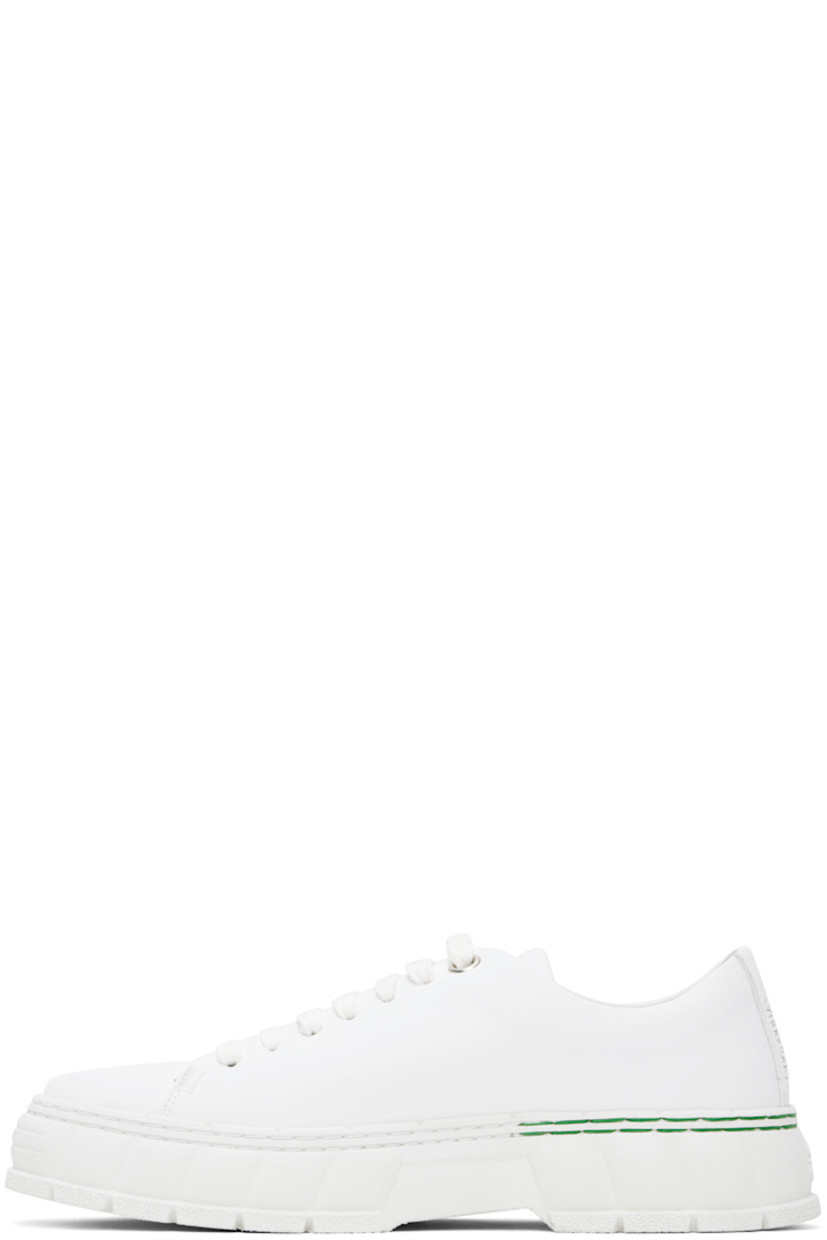 Handcrafted low-top buffed corn leather sneakers in white.

· Lace-up closure
· Logo embossed at tongue and heel
· Text embossed at outer side
· Grained faux-leather insole
· Faux-suede lining
· Treaded recycled rubber-blend sole
 
Supplier color: White