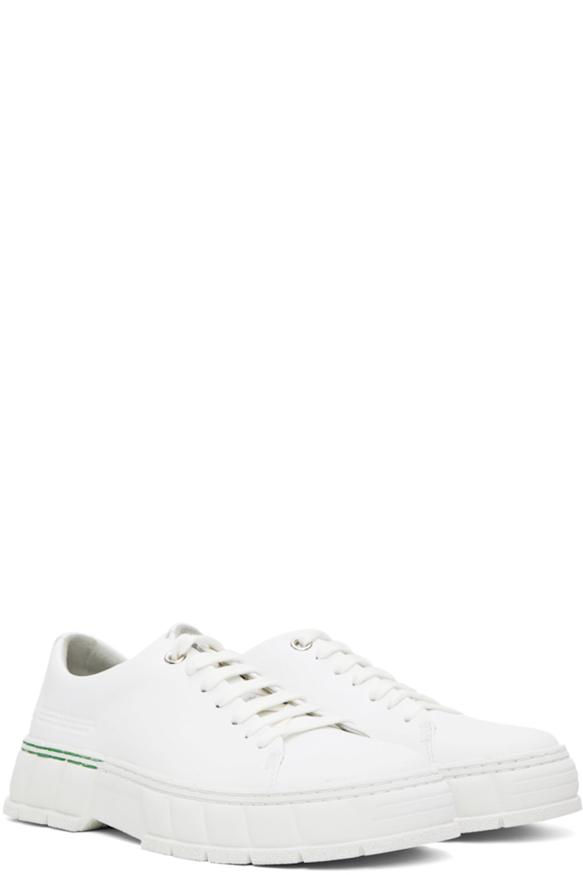 Handcrafted low-top buffed corn leather sneakers in white.

· Lace-up closure
· Logo embossed at tongue and heel
· Text embossed at outer side
· Grained faux-leather insole
· Faux-suede lining
· Treaded recycled rubber-blend sole
 
Supplier color: White