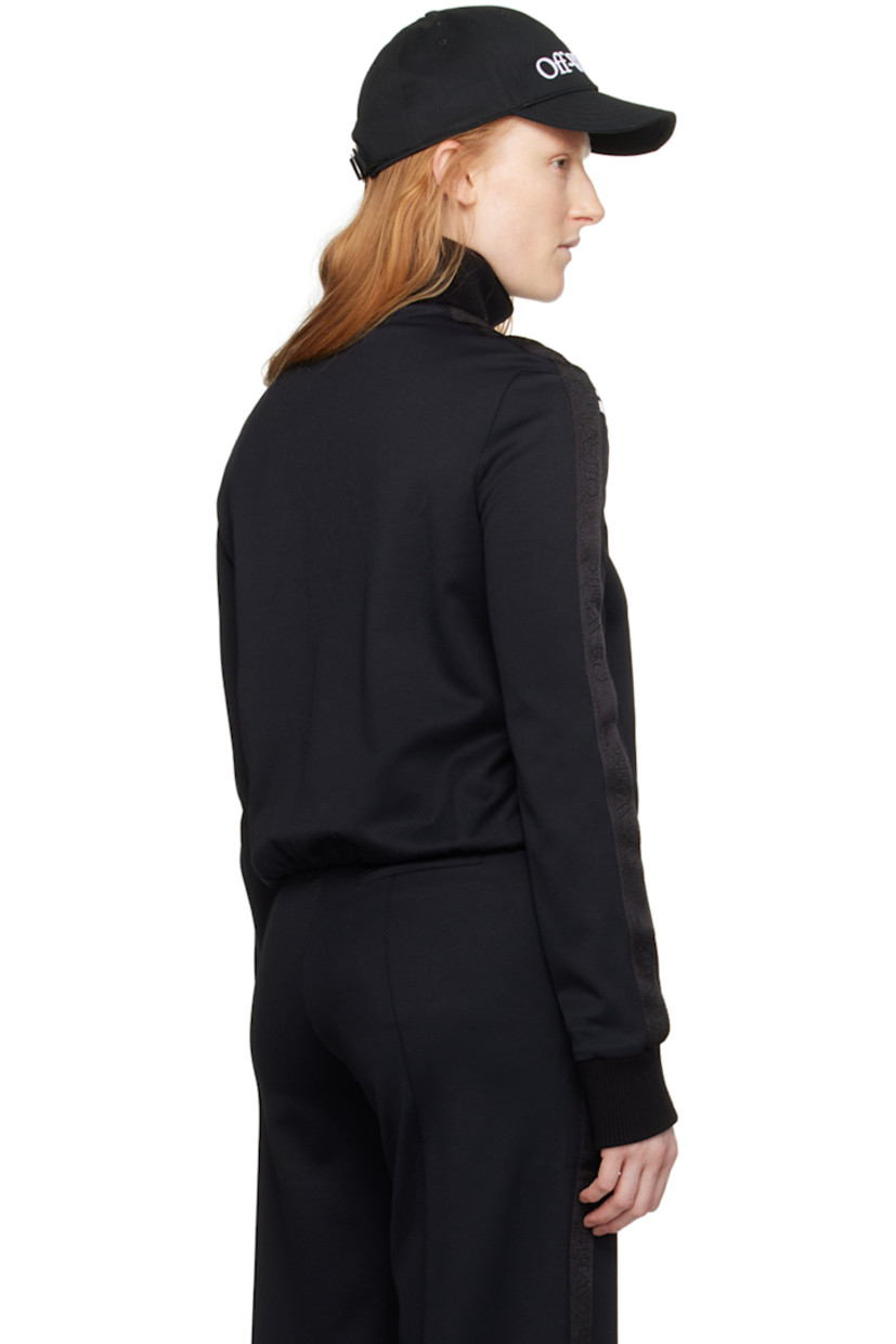 Paneled stretch nylon twill jacket.

· Rib knit mock neck and cuffs
· Half-zip closure
· Intarsia rib knit stripes at front
· Elasticized hem
· Logo-woven webbing trim at sleeves

Supplier color: Black/White