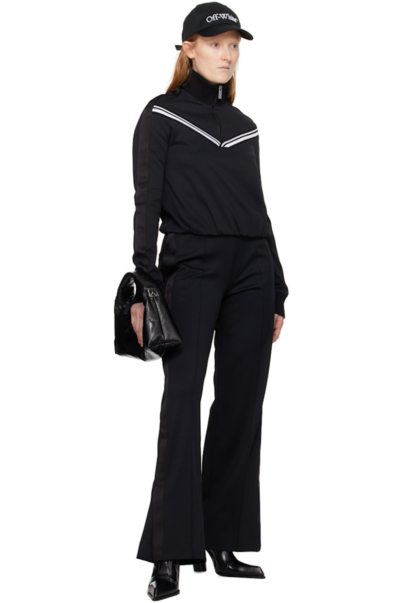 Paneled stretch nylon twill jacket.

· Rib knit mock neck and cuffs
· Half-zip closure
· Intarsia rib knit stripes at front
· Elasticized hem
· Logo-woven webbing trim at sleeves

Supplier color: Black/White