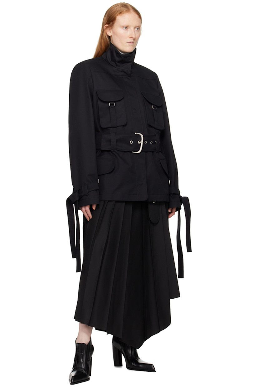 Cotton canvas jacket. 

· Funnel neck
· Concealed press-stud closure
· D-ring at flap pockets
· Detachable pin-buckle belt
· Detachable self-tie trim at cuffs
· Logo embossed at back collar
· Pinched seam at back
· Full logo-woven viscose twill lining
· Silver-tone hardware

Supplier color: Black