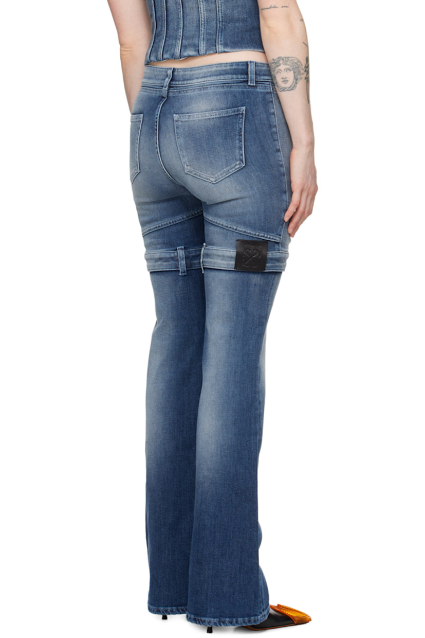 Flared stretch denim jeans. Fading and whiskering throughout.

· Belt loops at waistband and legs
· Two-pocket styling
· Zip-fly
· Mock pockets at front legs
· Leather logo patch at back leg
· Logo-engraved silver-tone hardware

Supplier color: Blue