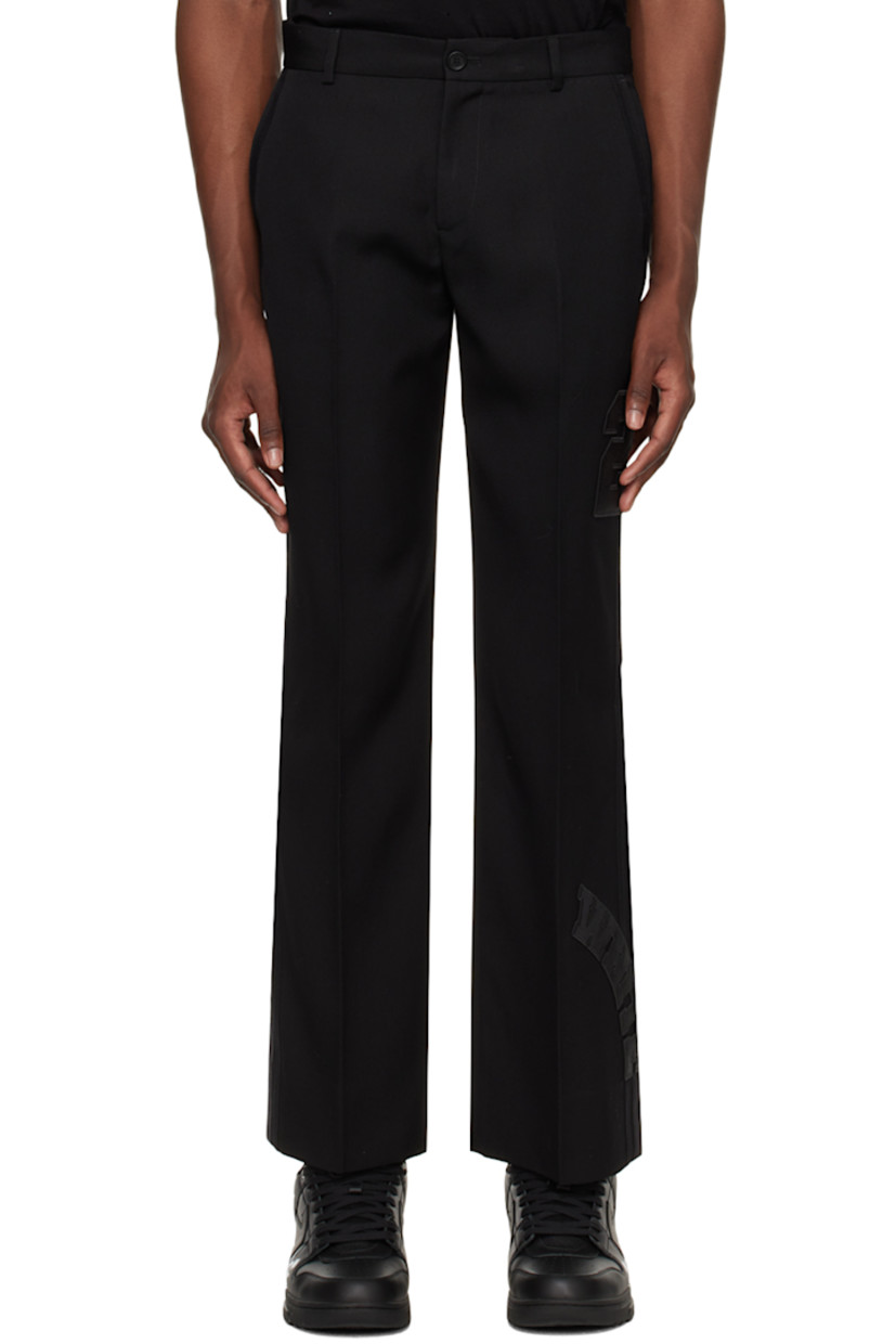 Plain-woven virgin wool trousers.

· Belt loops
· Zip-fly
· Four-pocket styling
· Creased legs
· Appliqués at leg and cuff
· Grosgrain trim at outseams
· Logo-engraved silver-tone hardware
· Partial satin and jersey lining

Supplier color: Black/Black