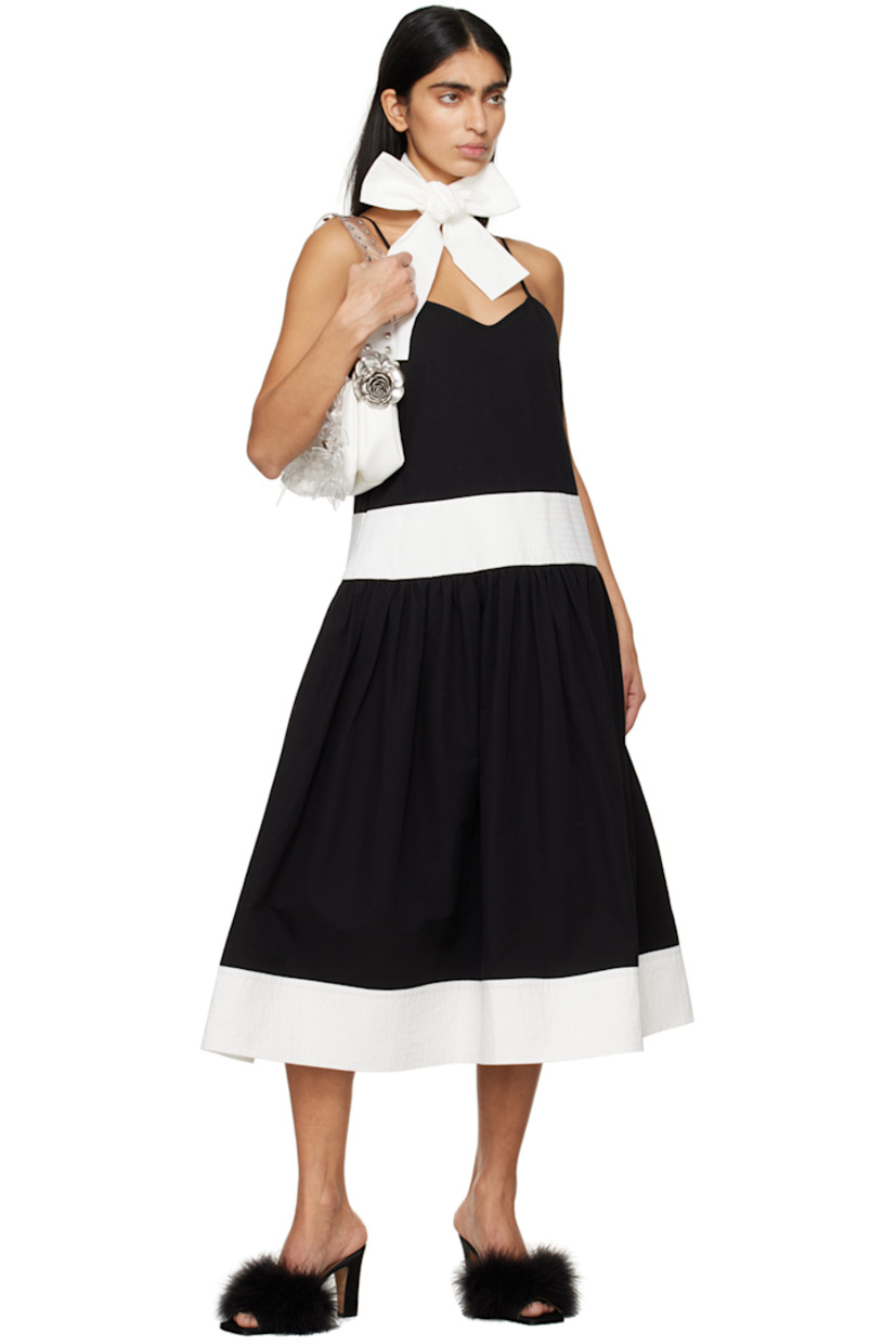 Cotton- and linen-blend broadcloth dress. Self-tie scarf included.

· Paneled construction
· Sweetheart neck
· Gathering at flared hem
· Seam pockets
· Adjustable shoulder straps
· Concealed zip closure at back

Supplier color: Black/White