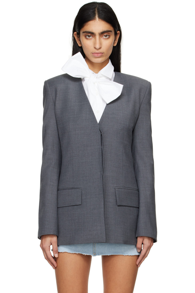 Stretch wool-blend delaine blazer.

· Y-neck
· Concealed button closure
· Flap pockets
· Padded shoulders
· Twin vents at back hem
· Full satin lining

Supplier color: Grey