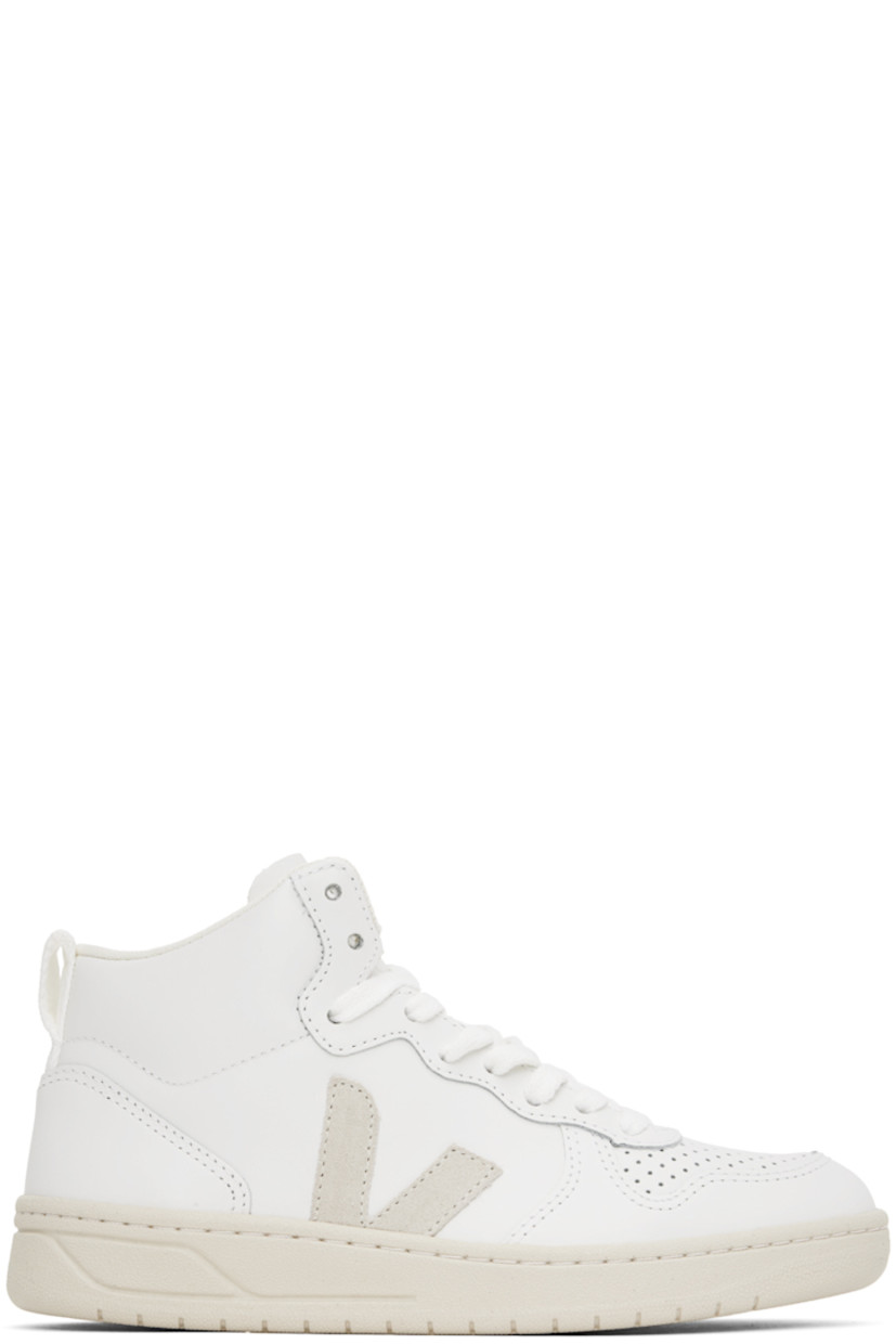 High-top buffed leather sneakers in white. 

· Perforated detailing at toe
· Lace-up closure
· Logo embossed at tongue
· Padded collar
· Webbing pull-loop at heel collar
· Suede logo appliqué at sides
· Mesh lining
· Treaded rubber sole

Supplier color: Extra white/Natural