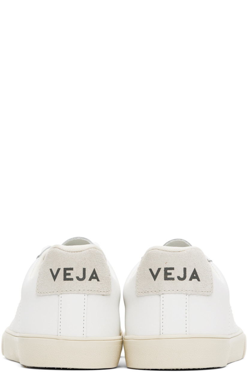 Low-top REACH-certified buffed leather sneakers in white.

· Lace-up closure
· Logo printed at tongue 
· Padded collar
· Logo topstitched at sides
· Logo printed at non-PFC-coated suede heel counter
· Mesh lining
· Treaded rubber sole

Supplier color: Extra white