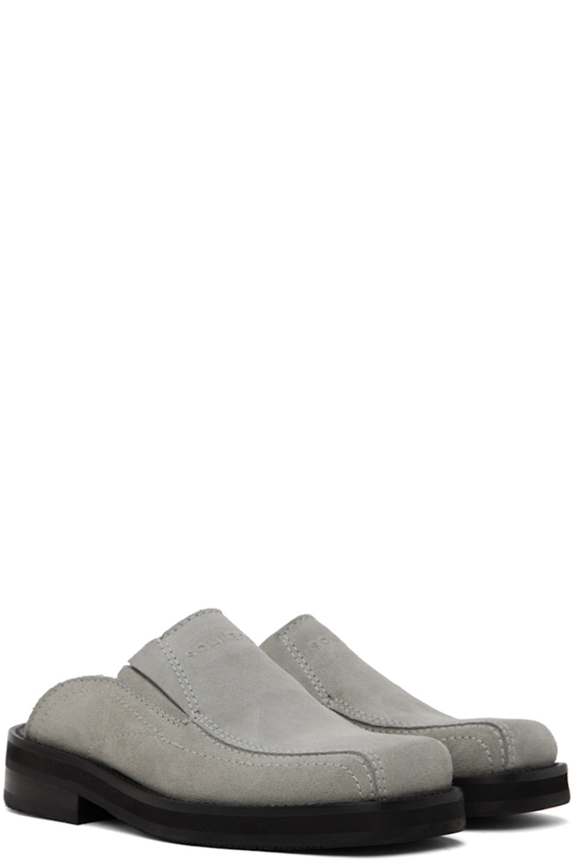 Suede mules in gray.

· Square toe
· Logo embossed at vamp
· Concealed elasticized gusset at sides
· Logo embossed at padded leather footbed
· Grained leather lining
· Topstitching at welt 
· Stacked leather heel with rubber injection
· Treaded rubber sole
· Heel: H1.25"

Supplier color: Grey