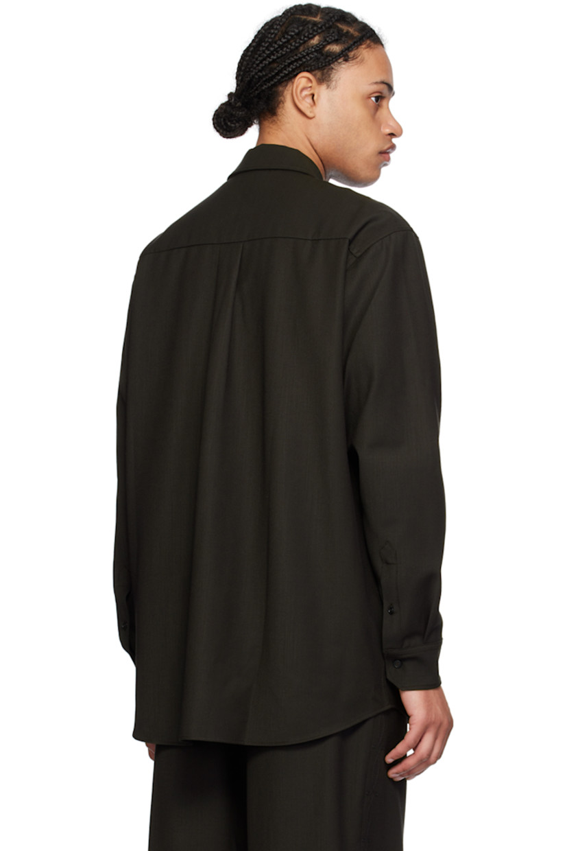 Stretch polyester- and wool-blend twill shirt.

· Spread collar
· Two-way zip closure
· Graphic pattern embroidered at front
· Modified shirttail hem
· Two-button barrel cuffs
· Box pleat at back yoke

Supplier color: Brown embroidered