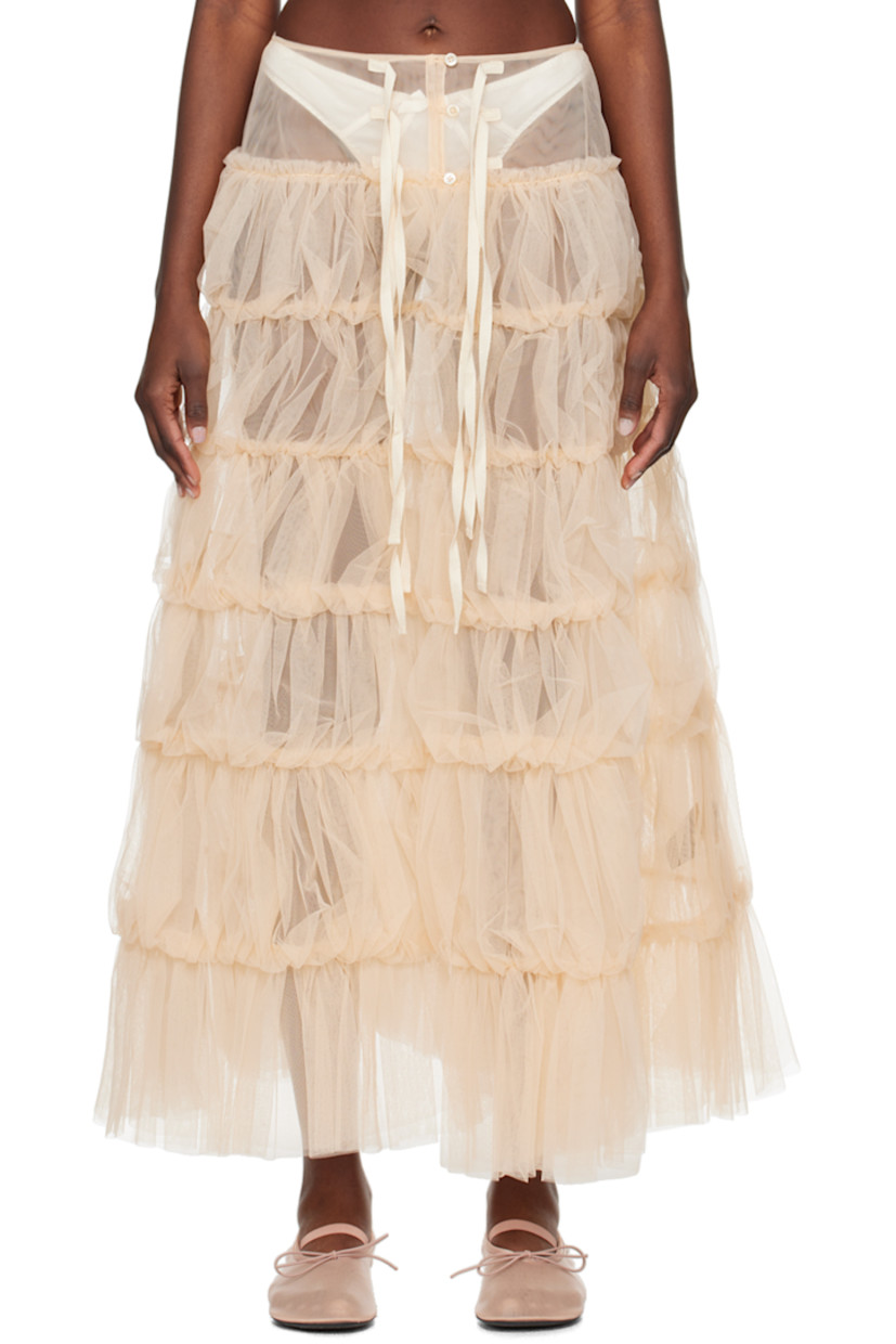 Sheer nylon tulle skirt. Ruffles, pleats, and gathering throughout.

· Tiered construction
· Button and self-tie closure
· Slit at front
· Unlined

Supplier color: Dust pink