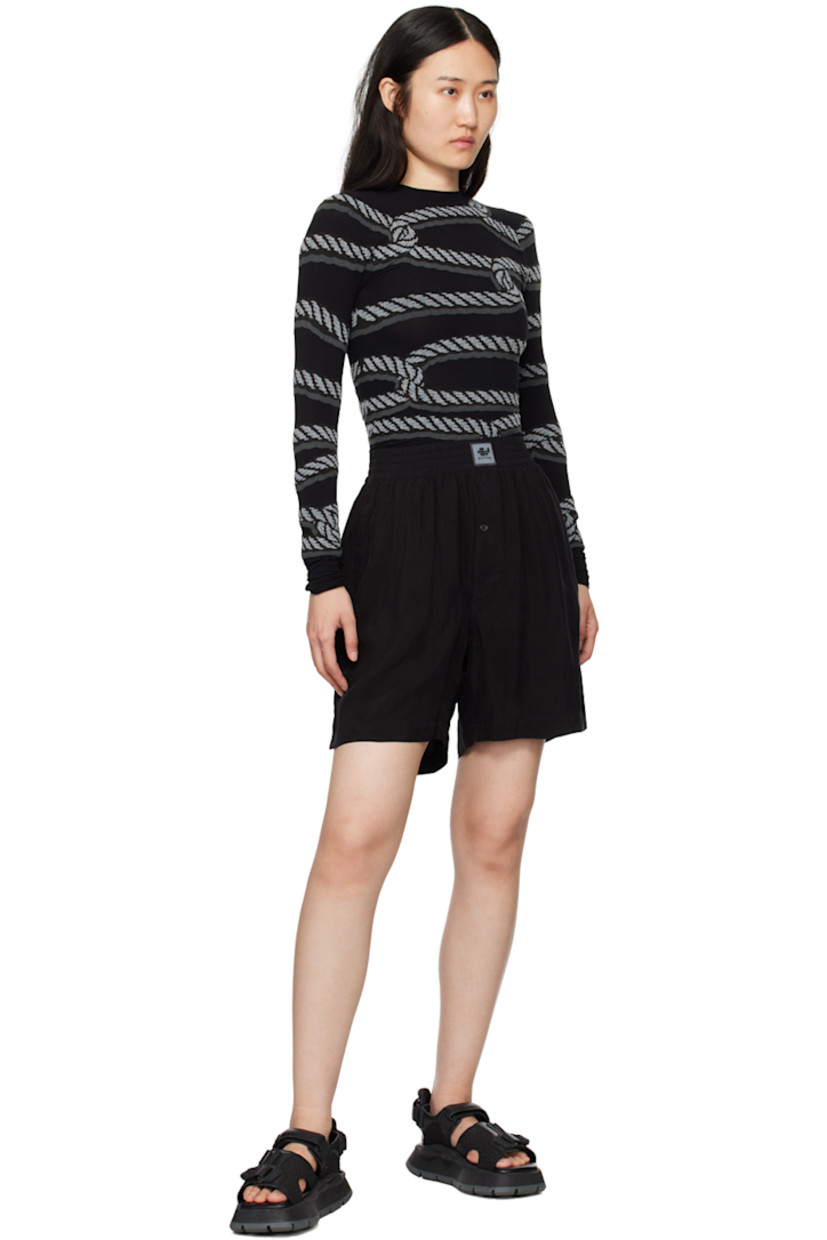 Cupro sateen shorts.

· Rubberized logo patch at elasticized waistband
· Three-pocket styling 
· Exposed single-button-fly

Supplier color: Black