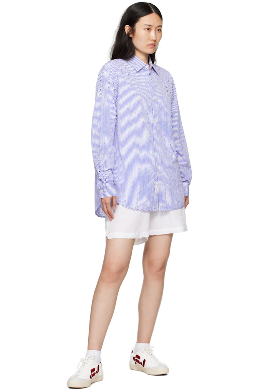 Plain-woven viscose- and linen-blend shorts.

· Rubberized logo patch at elasticized waistband
· Three-pocket styling 
· Exposed single-button-fly

Supplier color: White